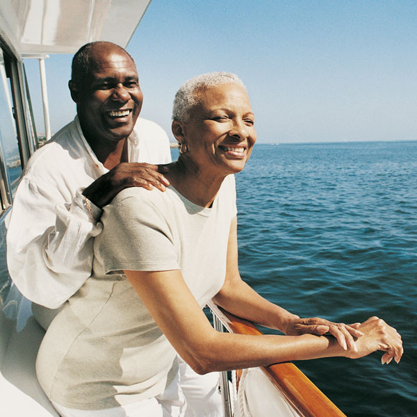 mature man and woman enjoying a boat ride