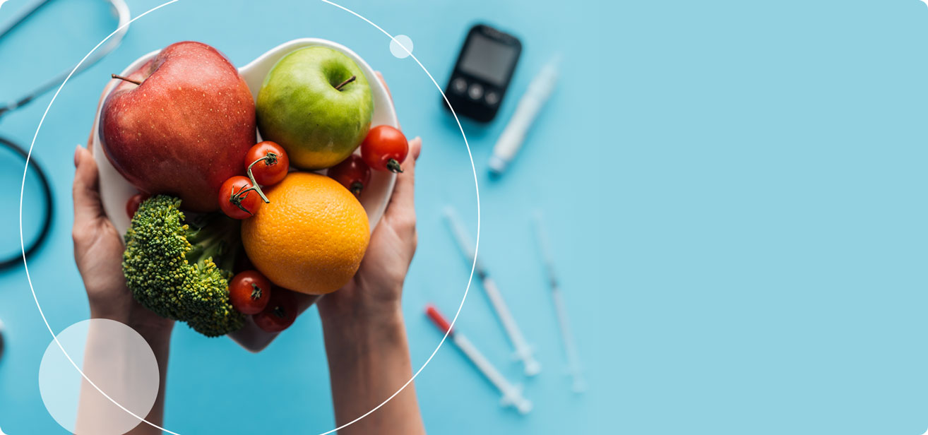 woman holding bowl of fruits and vegetables with syringes in the background.